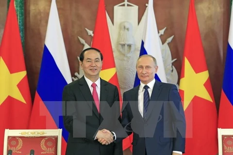 越南国家主席陈大光（左）与俄总统普京（右）。（图片来源：越通社）