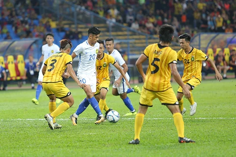 第29届东南亚运动会男足比赛：东道主马来西亚队以2比1击败文莱队。（图片来源：因特网）