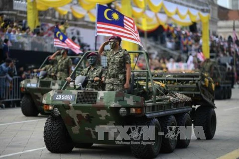资料图：马来西亚军队建军60周年阅兵式。