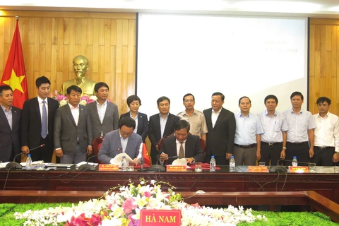 河南省人民委员会与韩国京畿道签署合作备忘录。（图片来源：越通社）