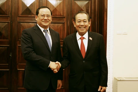 越南政府副总理张和平与老挝政府副总理宋赛 • 西潘敦。