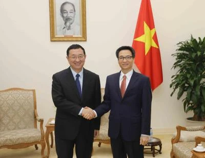 越南政府副总理武德儋会见中国文化部部长雒树刚。（图片来源：越通社）