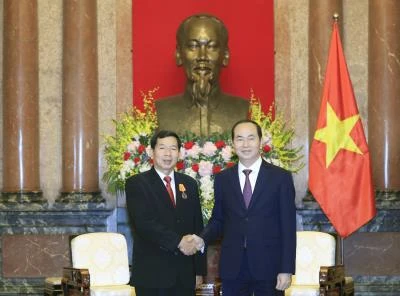 越南国家主席陈大光会见老挝最高人民法院院长坎潘·西提丹帕。（图片来源：越通社）