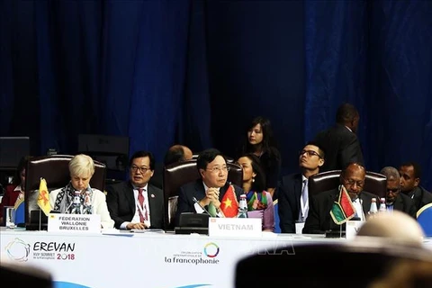 越南政府副总理兼外长范平明在第十七届法语国家组织峰会上发言