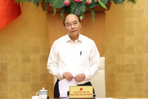 政府总理阮春福：以更加坚强的意志、更加严密的措施全面加强疫情防控工作