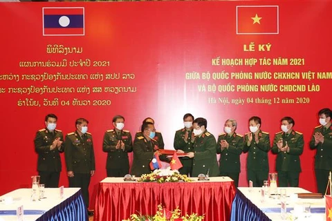越南与老挝国防部签署2021年合作计划 