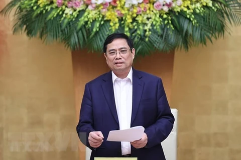 越南政府总理范明政同越南国家银行举行工作会议