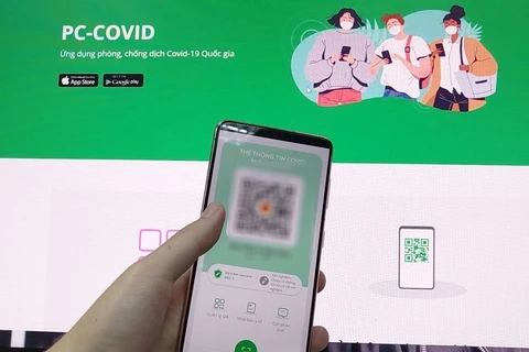 胡志明市使用PC-COVID应用参与社会经济活动