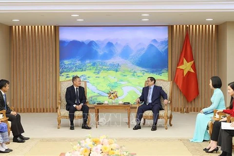 越南政府总理范明政：越通社与老通社应加强合作 在人力资源培训方面相互支持