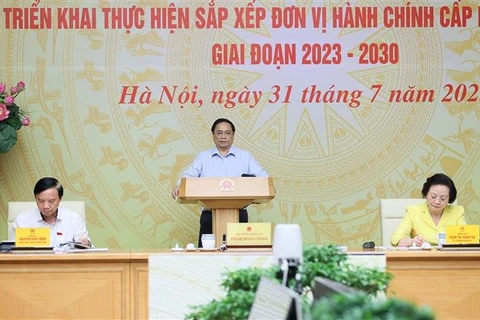 越南政府总理范明政主持召开全国县乡行政单位设置工作视频会议