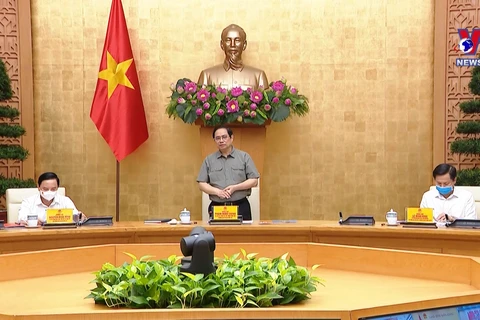 越南政府总理范明政主持国家新冠肺炎疫情防控指导委员会会议