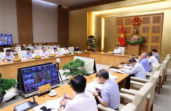 Participants in the conference chaired by Deputy PM Tran Hong Ha on May 21. (Photo: VNA)