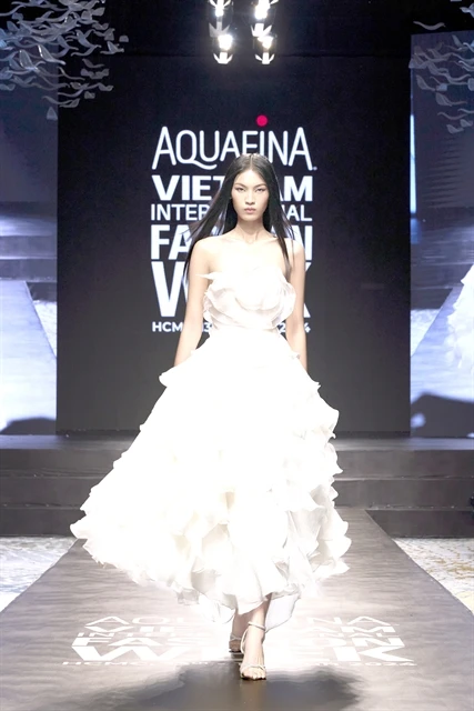 Huynh Tu Anh, winner of The Face Vietnam 2023, in a dress by designer Vo Cong Khanh, who will open the AVIFW 2024 with his latest collection called “Kiet Tac Cua Nuoc” (Masterpiece of Water). (Photo courtesy of Multimedia JSC)