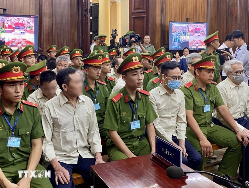 Defendants involved in the Vietnam Register corruption case at the first-instance trial opened in HCM City on July 18. (Photo: VNA)