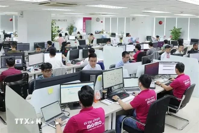 The Momo e-wallet staff at their office. (Illustrative photo: VNA)