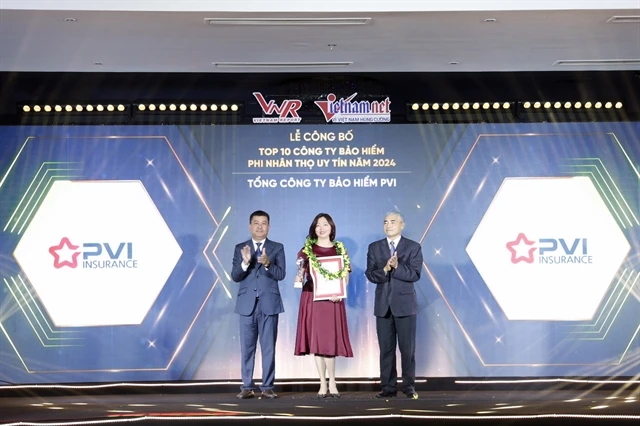 Nguyen Vu Tam, Deputy General Director of PVI Insurance, receives the Top 10 Most Reputable Insurance Companies in Vietnam award on behalf of the company. (Photo courtesy of PVI Insurance)