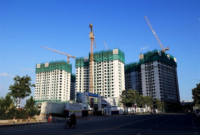 A housing project in HCM City. The State will regulate the market if property price rise by 20 per cent for three months. (Photo: VNA)