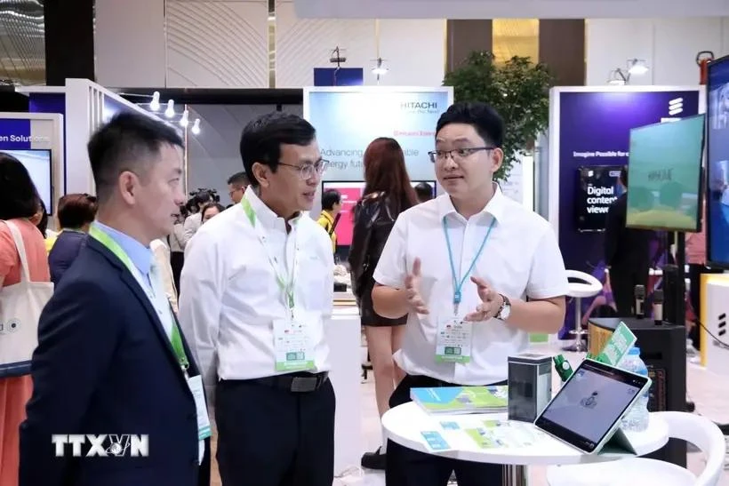 Visitors learn about solutions and information on high technology and green economy at the Swedish exhibition that opens in HCM City on October 21. (Photo: VNA)