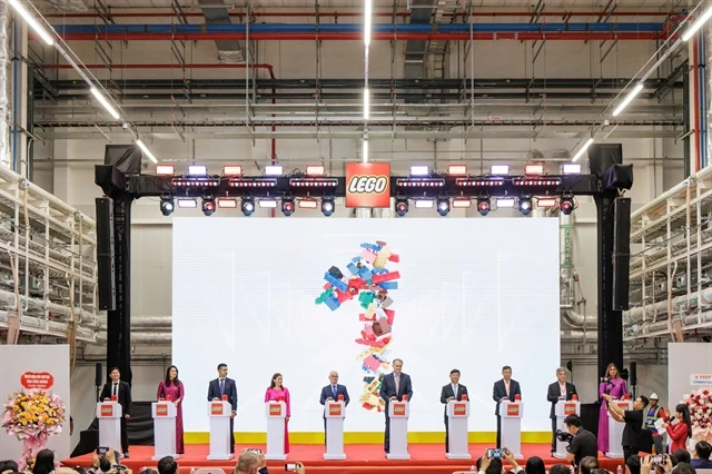 Delegates participate in a celebration event to begin testing systems at the LEGO factory in the southern province of Binh Duong. (Photo courtesy of LEGO Manufacturing Vietnam)