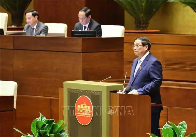 PM Pham Minh Chinh fields legislators' questions at the 15th NA's ongoing 8th session on November 12. (Photo: VNA)