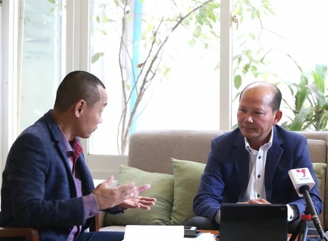 Researcher Uch Leang (right) in the interview with Vietnam News Agency. (Photo: VNA)