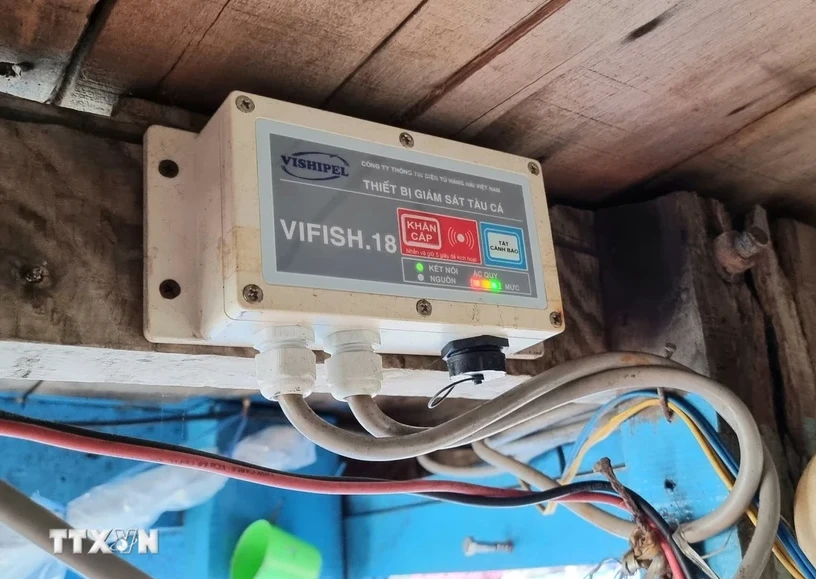 A journey monitoring device installed on a fisherman's boat. (Photo: VNA)