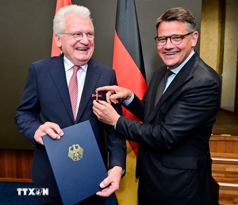 Minister-President of the State of Hessen of Germany Boris Rhein (R) presents Order of Merit to