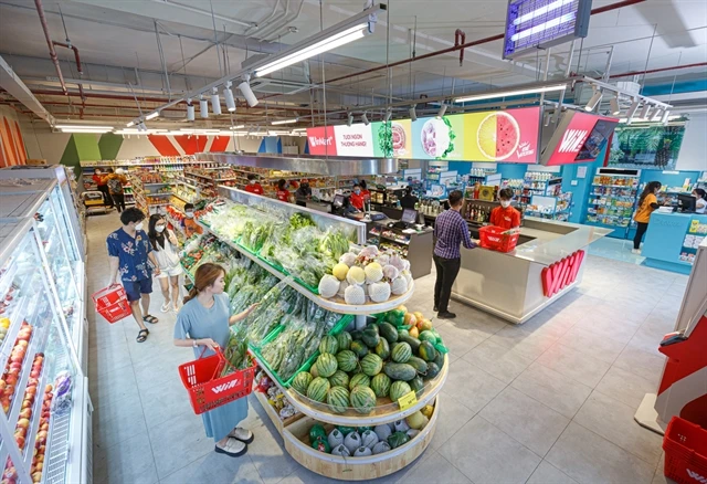 Customers shop at a WinMart store belonging to Masan Group in HCM City. (Photo courtesy of Masan)