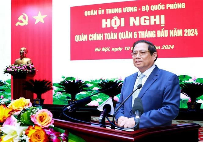 Prime Minister Pham Minh Chinh addresses the national political-military conference on July 10 (Photo: VNA)