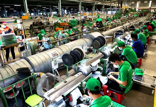 A company in HCM City. With new orders rising sharply, manufacturers ramped up production in July. (Photo: VNA)