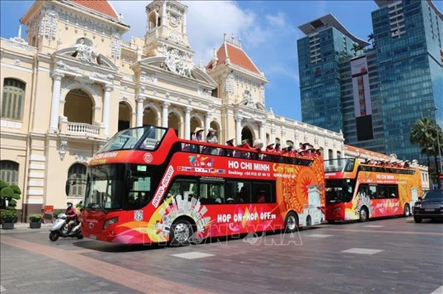 The hop-on hop-off buses in HCM City. The city is among the top destinations in Việt Nam that tourists from Australia want to visit. (Photo: VNA)