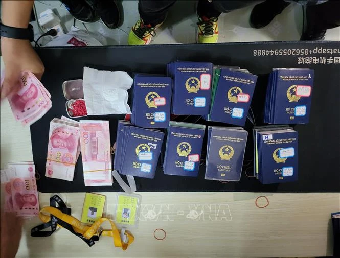 Nearly 100 passports are confiscated (Photo: VNA)