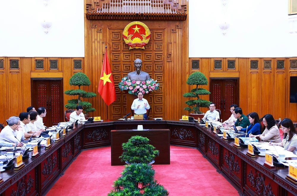 Prime Minister Pham Minh Chinh speaks at the meeting in Hanoi on August 14. (Photo: VNA)