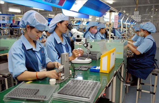 Workers at Canon Electronics Factory in Pho Noi A Industrial Park in the northern province of Hung Yen. (Photo: VNA) 