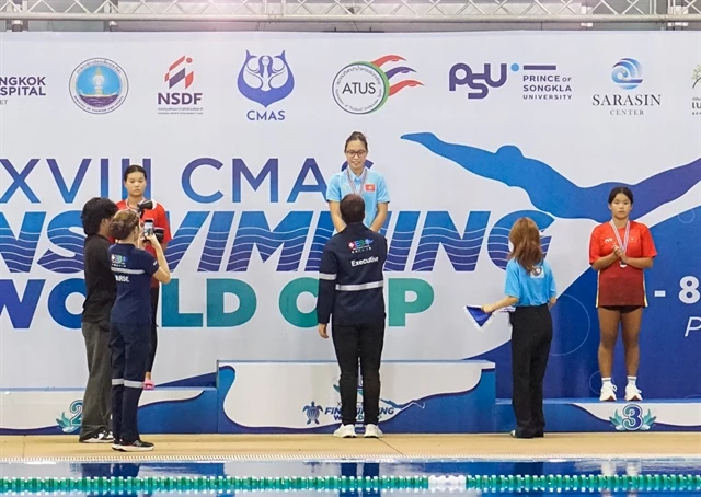 Vietnamese Nguyen Tran San San (top podium) and two teammates at the victory ceremony of the girls' 12-17 year-old 1.500m surface at the 18th CMAS Finswimming World Cup 2024 Round 4 in Phuket, Thailand (Photo: HCMC Finswimming)