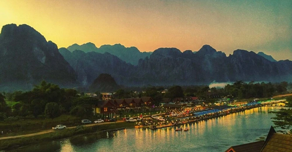 Vang Vieng is a town in the Lao province of Vientiane, about halfway to Luang Prabang, known for its picturesque views, limestone cliffs and caves. (Photo: laotiantimes.com)