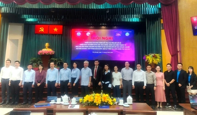 Delegates at the conference on implementing the digital transformation support programme for assessing the current status and readiness for e-commerce and digital transformation in HCM City. (Photo: courtesy of congan.com.vn)