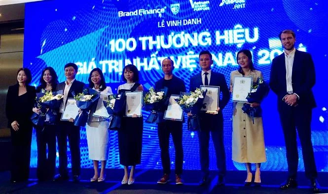 100 Vietnamese businesses with the biggest brand value are honoured at a ceremony in HCM City on October 11. (Photo: VNA)