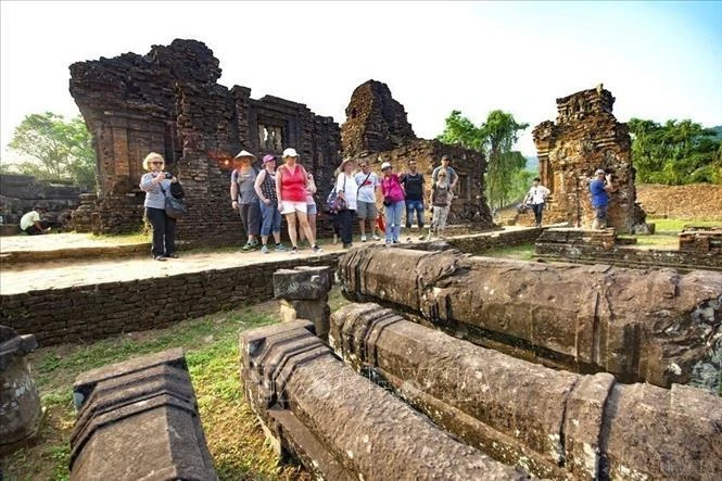 Foreign tourists visit My Son Sanctuary in the central province of Quang Nam. (Photo: VNA)