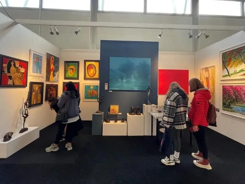 Visitors look at artworks by 13 Vietnamese painters at the Affordable Art Fair in London.(Photo: VNA)