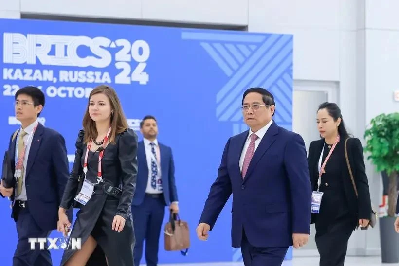 PM Pham Minh Chinh comes to attend the expanded BRICS Summit's plenary session. (Photo: VNA)