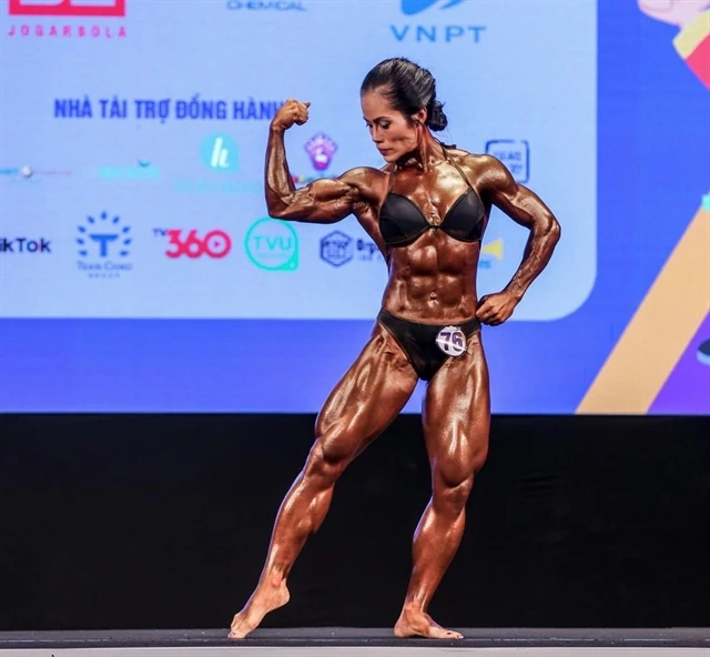 Vietnamese athlete Dinh Kim Loan will defend her title in the women's 55kg bodybuilding class at the 15th World Bodybuilding and Physique Sports Championships. (Photo: VTCNews)