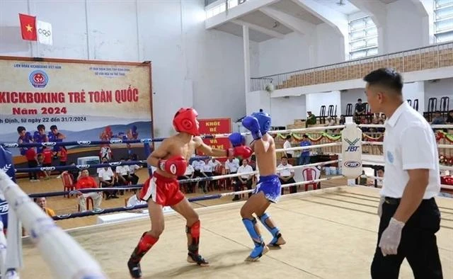 Los jóvenes compiten en el Campeonato Nacional de Kickboxing Infantil 2024. (Foto del equipo deportivo de Vietnam)