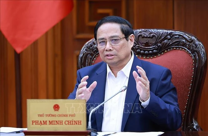 Le Premier ministre Pham Minh Chinh, chef du comité de pilotage pour la révision et le démêlage des nœuds dans le système des documents juridiques. Photo : VNA