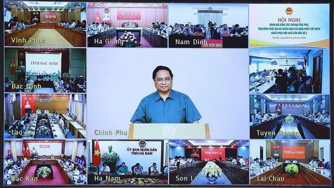 Prime Minister Pham Minh Chinh chairs the hybrid conference. (Photo: VNA)