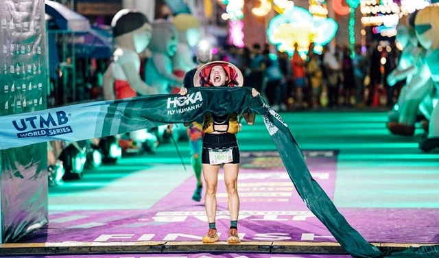 Ha Thi Hau celebrates her win at the Amazean Jungle Thailand by UTMB on May 4 in Thailand. (Photo of organisers) 