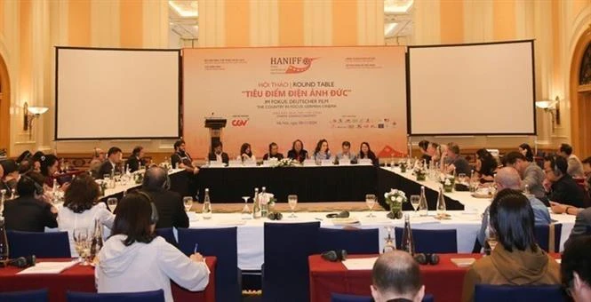 Filmmakers, experts, actors and actresses from Vietnam and Germany at the workshop to share experience in developing the cinema industry. (Photo: VNA)