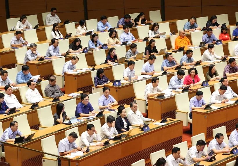 The NA’s fifth sitting day discusses three draft laws. (Photo: VNA)