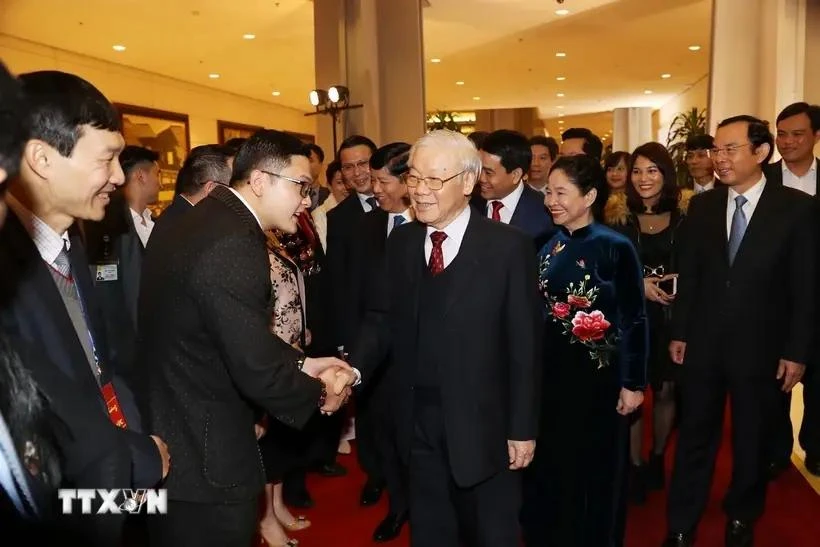 General Secretary and President Nguyen Phu Trong and his wife meet overseas Vietnamese returned home to celebrate Tet and attend the 2019 Homeland Spring programme in 2019 (Photo: VNA)