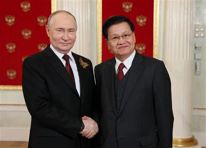 老挝国家主席通伦·西苏里与俄罗斯总统普京。图自法新社/越通社